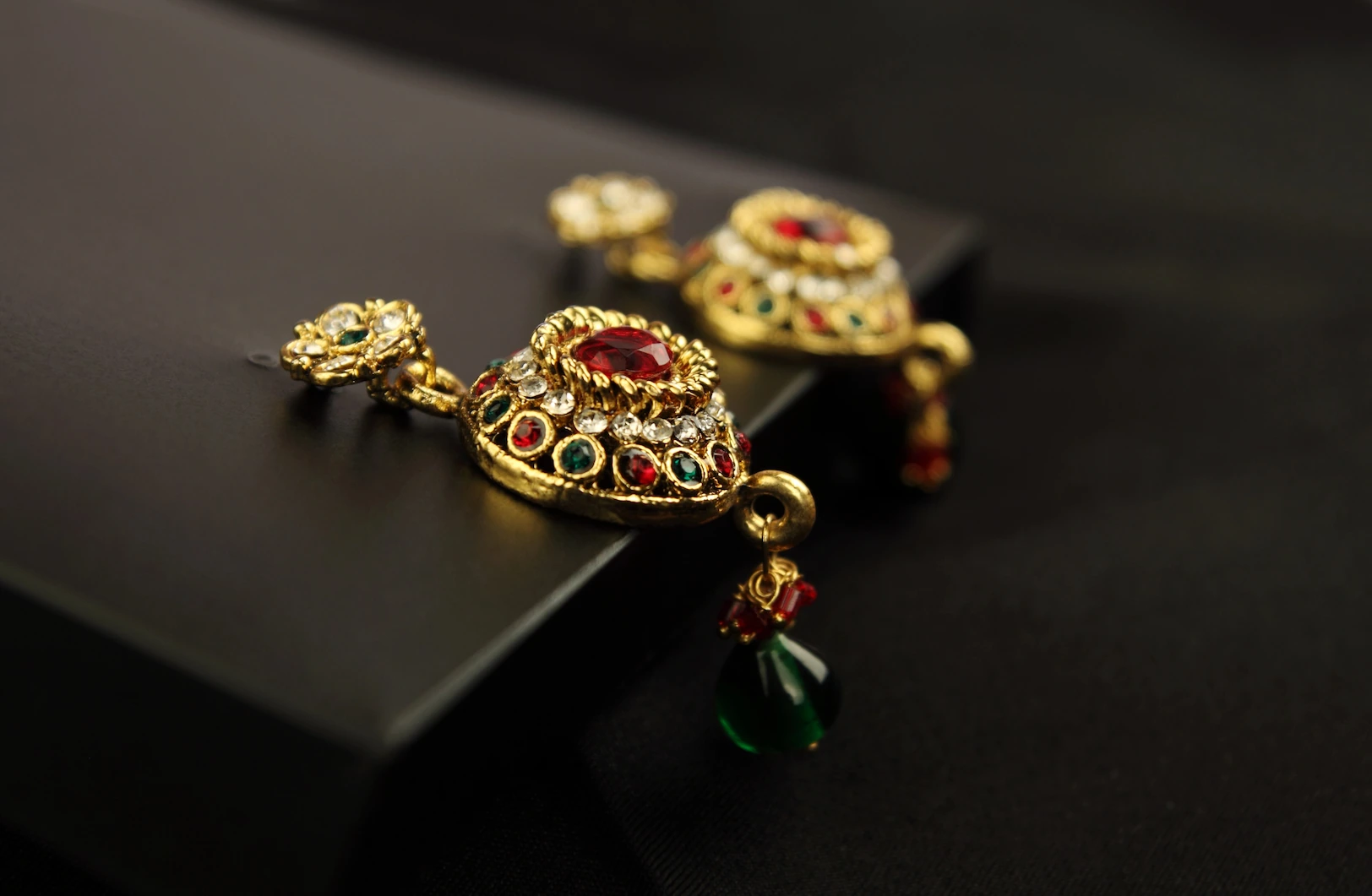 Gold pendants with gems